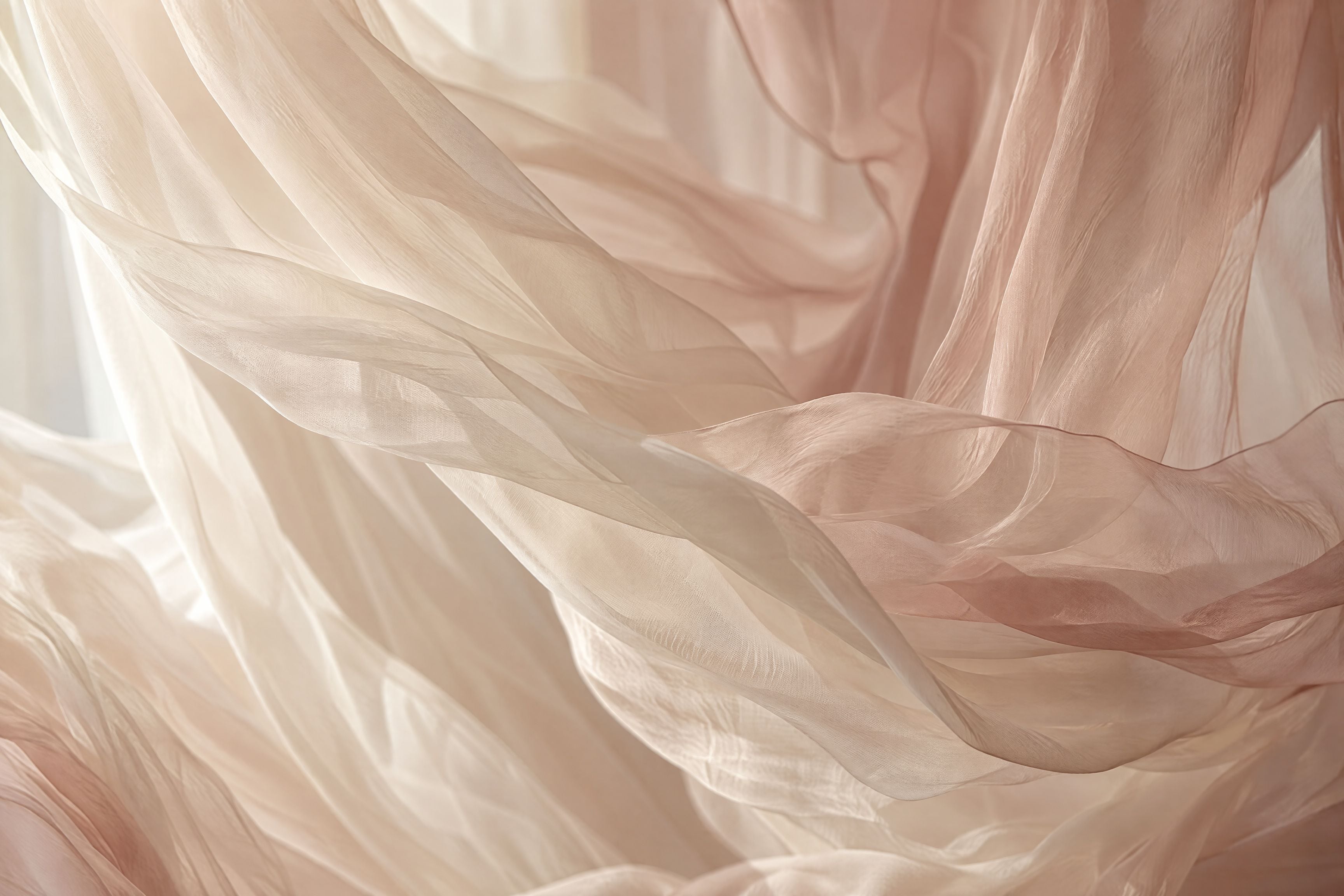 Sheer ivory fabric moving in window light